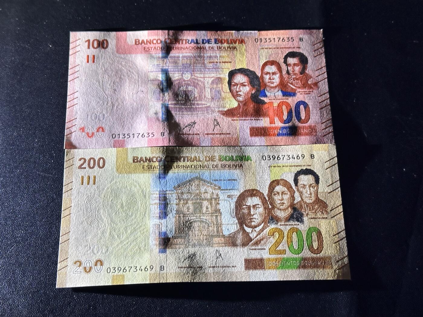 《外钞收藏家》第六百一十一期（农历新年第一场/快递恢复正常再发货）（长期征集拍品、欢迎藏友们联系合作） 玻利维亚100和200面额 2张一起 全新 尾（35、69）