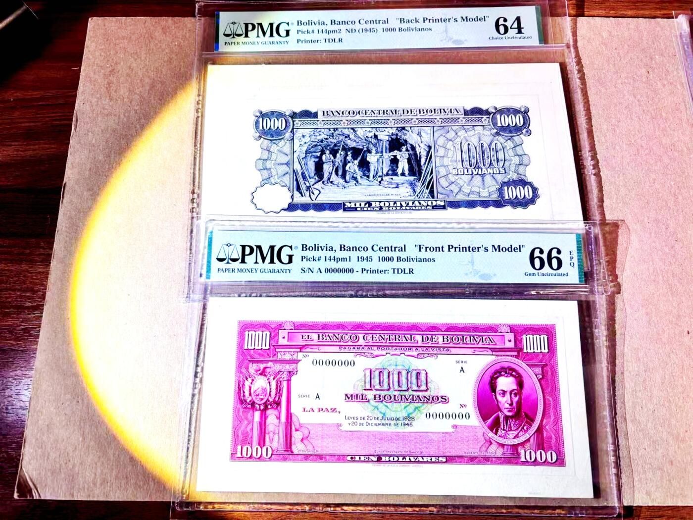 【Blue Auction】世界纸币精拍第787期——18级TOP拍卖/信誉/品质/专业/高效💫  【唯一冠军 唯一记录 TDLR试印设计稿正背面一对】玻利维亚1945年1000诺 玻利瓦尔与采矿 雕刻印制极为细腻 远超实钞 厚卡纸 该版实钞样钞存世均罕见 PMG66EPQ/64