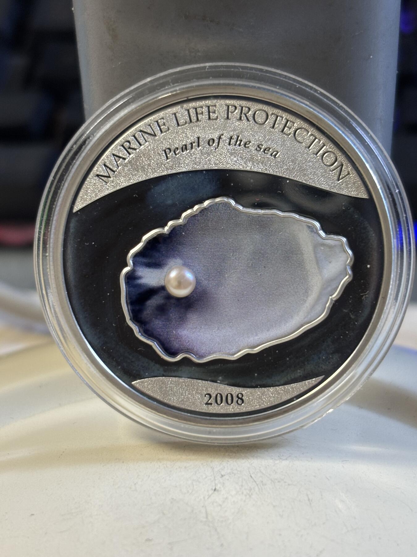 第191期拍卖 帕劳2008年珍珠系列镶嵌实体深海蓝珍珠纪念彩银币，925银，25克，发行2500枚，有氧化