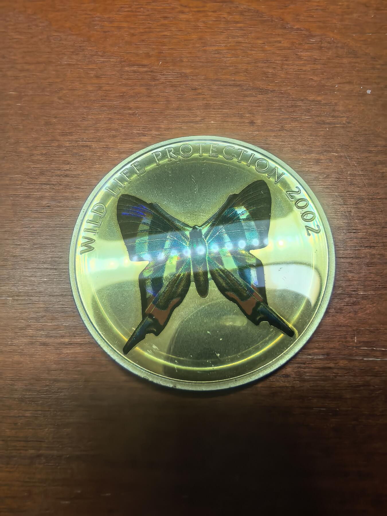 长老汇马年精选第一场拍卖 2002刚果非洲珍稀蝴蝶之多彩雨燕蝴蝶10法郎全息幻彩精制银币，25.95克925银，1.5万枚，克书65美金