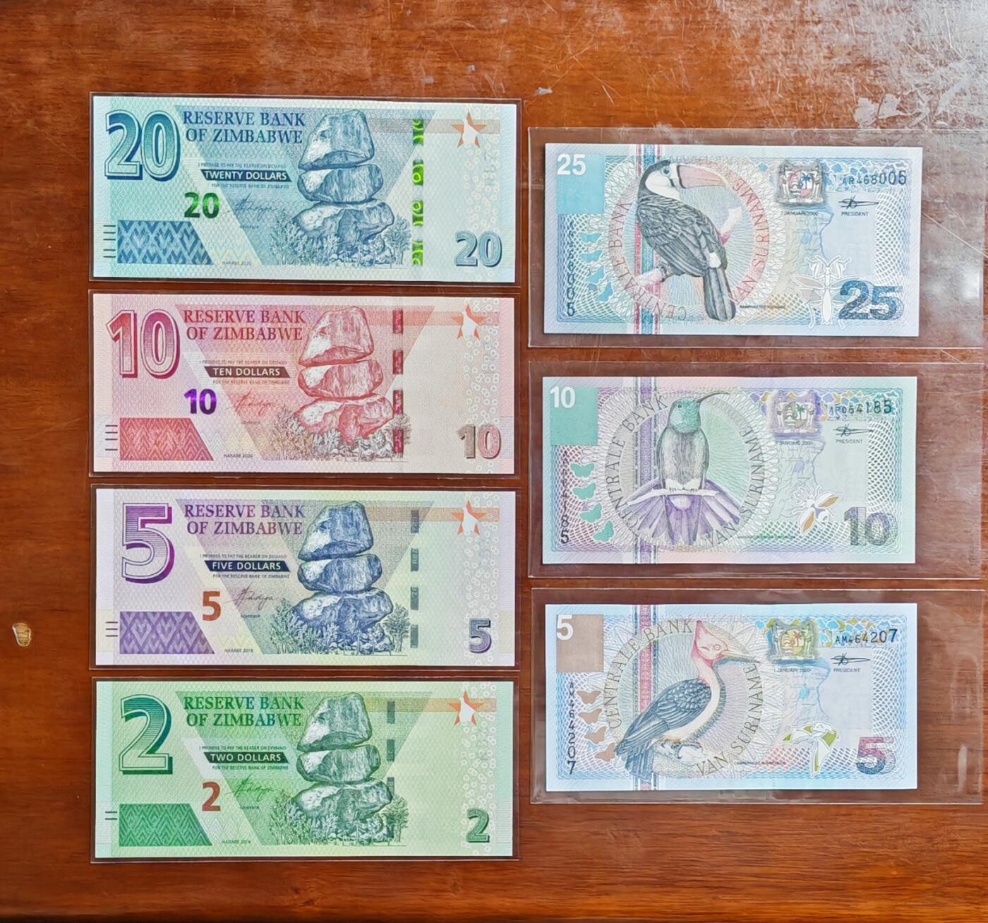 【礼羽收藏】🌏世界钱币拍卖125期 （一组7张）【UNC】非洲 津巴布韦2.5.10.20 + 苏里南5.10.25