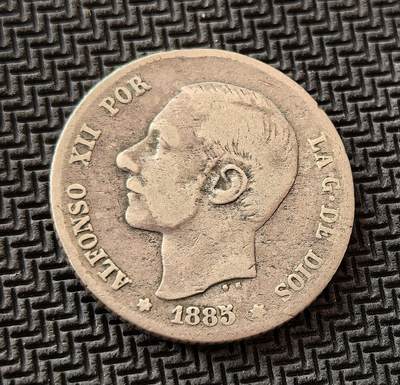 外国优质老铜币银币，初六晚九点倒数截拍，满百包邮，持续收拍，初八发货 - 西班牙1885 年1比塞塔银币5克0.835银纯银价88元，发行于阿方索十二世统治时期。正面为国王头像，彰显君主权威；背面的西班牙国徽与 “UNA PESETA” 字样，见证了西班牙帝国在殖民体系瓦解前的最后余晖，是近代西班牙历史的重要物证。