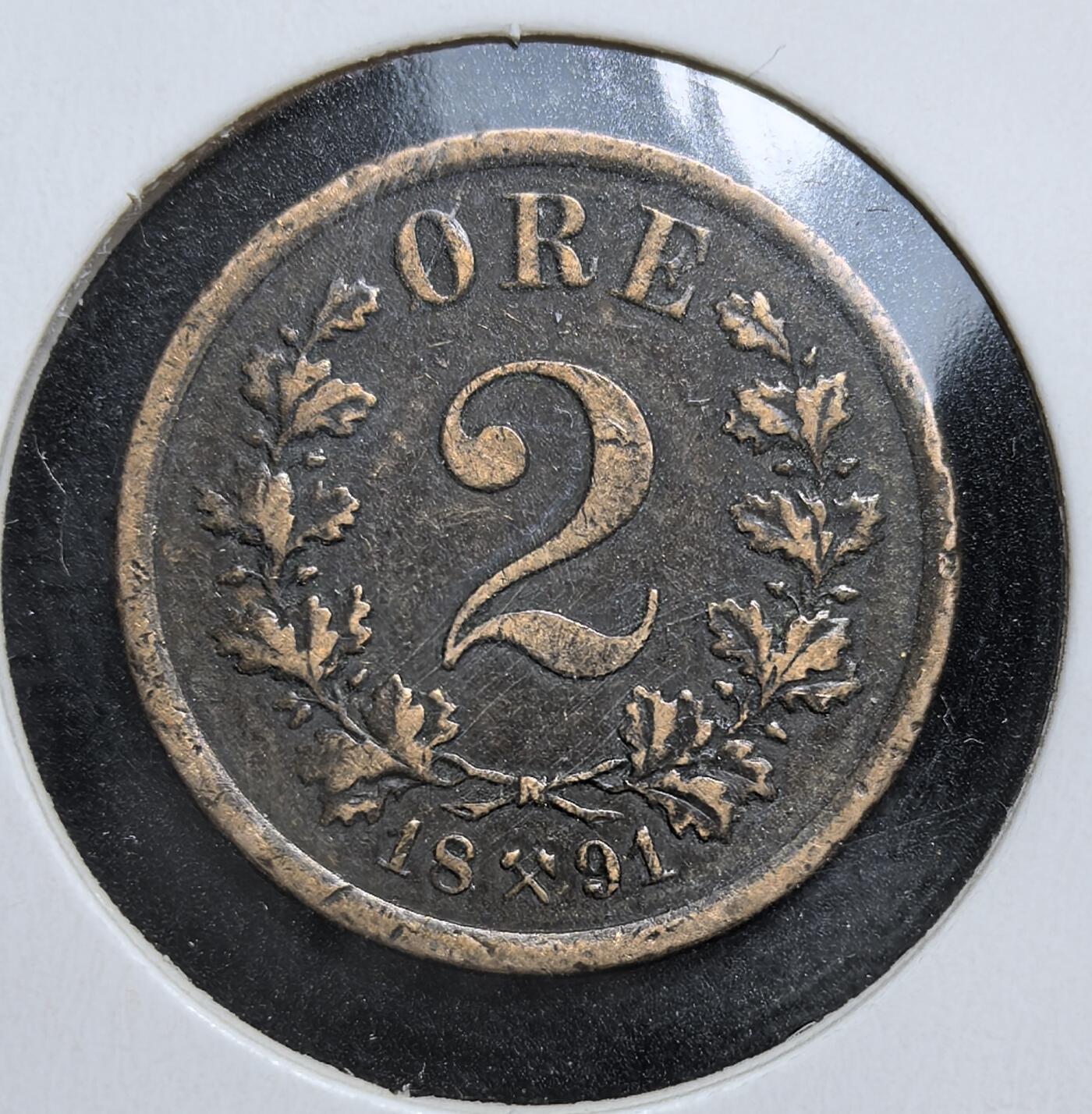外国优质老铜币银币，周日九点倒数截拍，满百包邮，持续收拍，初八发货 挪威1891年2欧尔。正面为面值与橡叶花环，象征农业与民生；背面是挪威国徽 “持斧雄狮”，代表奥斯卡二世统治时期。这枚硬币见证了挪威在瑞典 - 挪威联合王国时期的货币体系与国家认同。