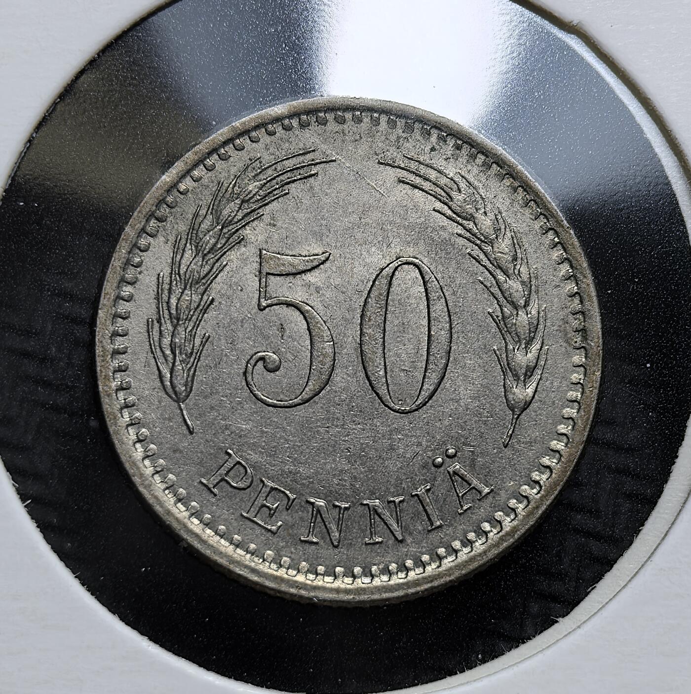 外国优质老铜币银币，周日九点倒数截拍，满百包邮，持续收拍，初八发货 芬兰1923年50盆尼，是芬兰独立后早期重要辅币。正面以面值与麦穗象征农业根基，背面为芬兰国徽 “持剑雄狮”。它发行于一战后经济恢复期，见证了芬兰货币体系的巩固与发展。