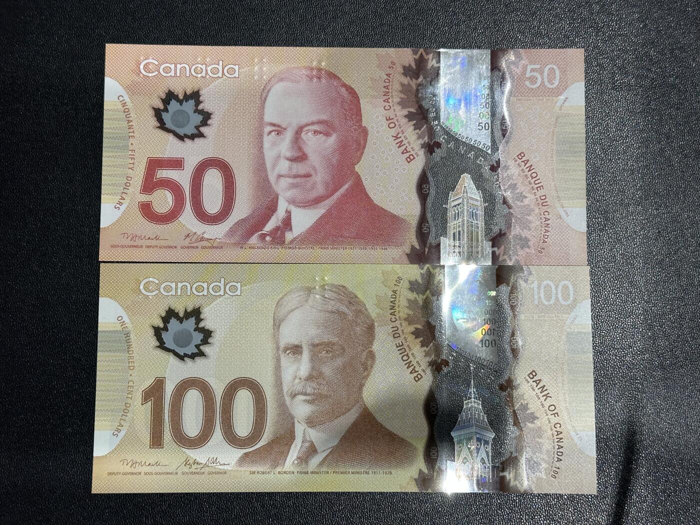 《外钞收藏家》第六百一十二期（ 精选场）（长期征集拍品、欢迎藏友们联系合作） 加拿大塑料钞50和100元 2张一起 全新UNC