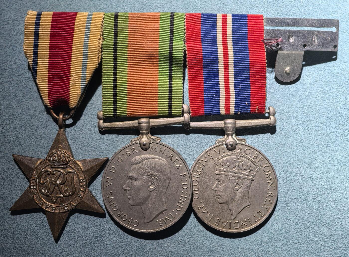 号角文化祝福各位藏友春节大吉马年入好藏 盛世勋华——号角文化勋章邮票专场拍卖第306期    英国二战四联联排 包括非洲之星奖章/二战战争奖章（南非版）/本土防卫奖章/非洲服役奖章（缺失） 均带刻名