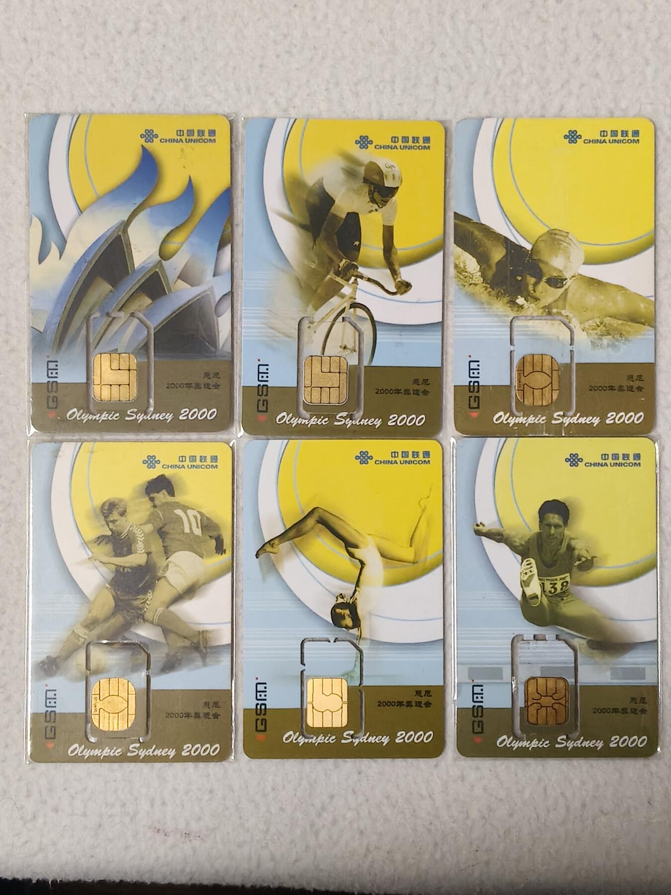易卡拍卖第77期《手机卡专场》 联通：悉尼2000年奥运会（其中6-3和6-5为固芯。另外四枚为组芯）。品相如图所示！（卡友出品。爱心义拍。）