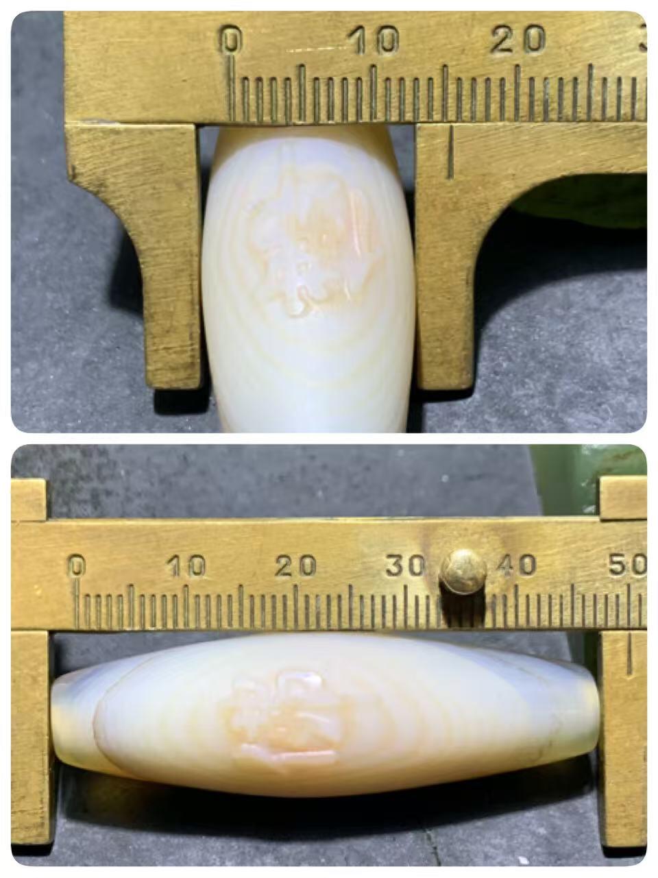 精美高玉化千层纹天眼图案海洋玉髓手工雕刻佛字桶珠一个！