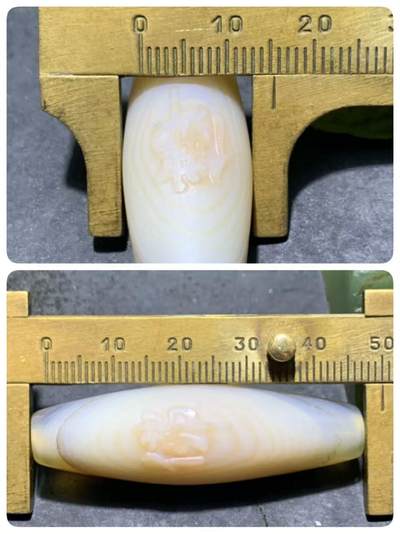 精美高玉化千层纹天眼图案海洋玉髓手工雕刻佛字桶珠一个！ 精美高玉化千层纹天眼图案海洋玉髓手工雕刻佛字桶珠一个！
