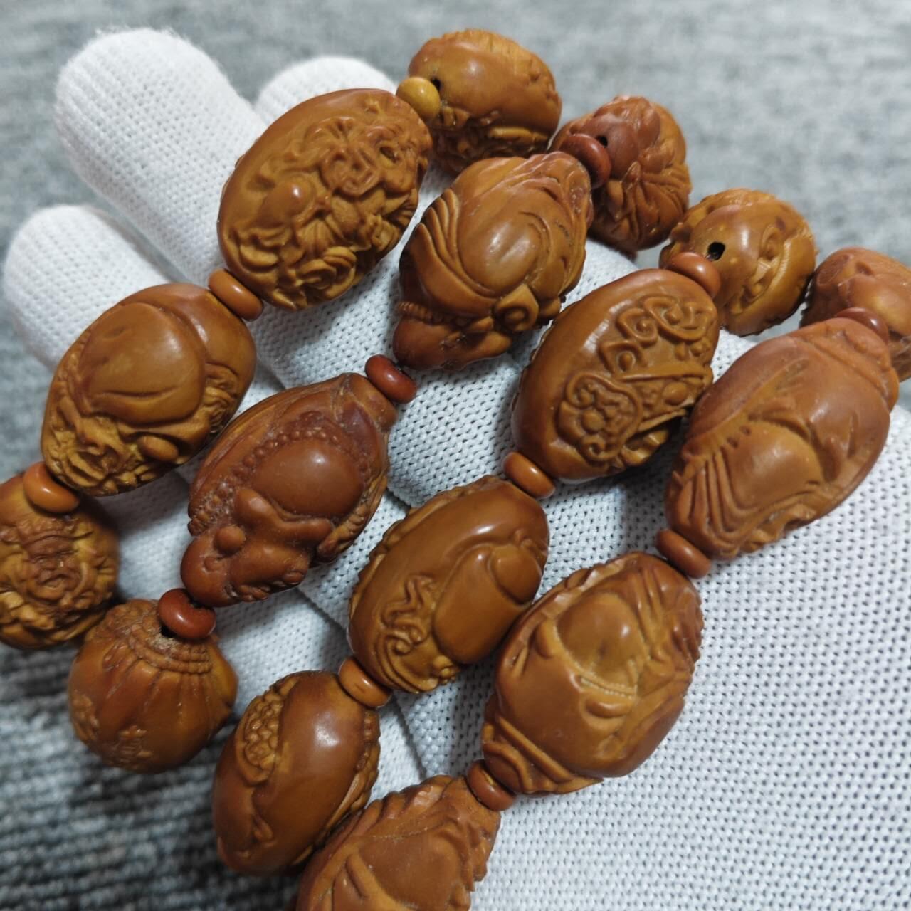 四条橄榄核核雕手串