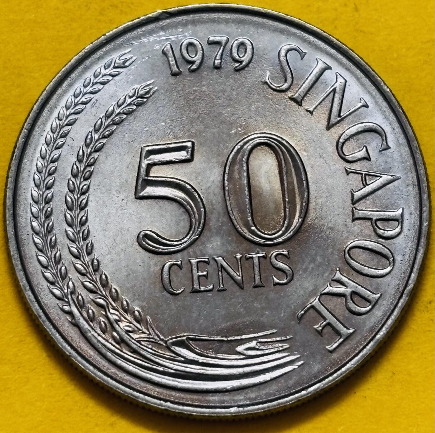 文馨钱币收藏第 295 场，（元宵场）各种银币散币纪念章，长期接代拍业务 原光 1979 年新加坡狮子鱼 50 分