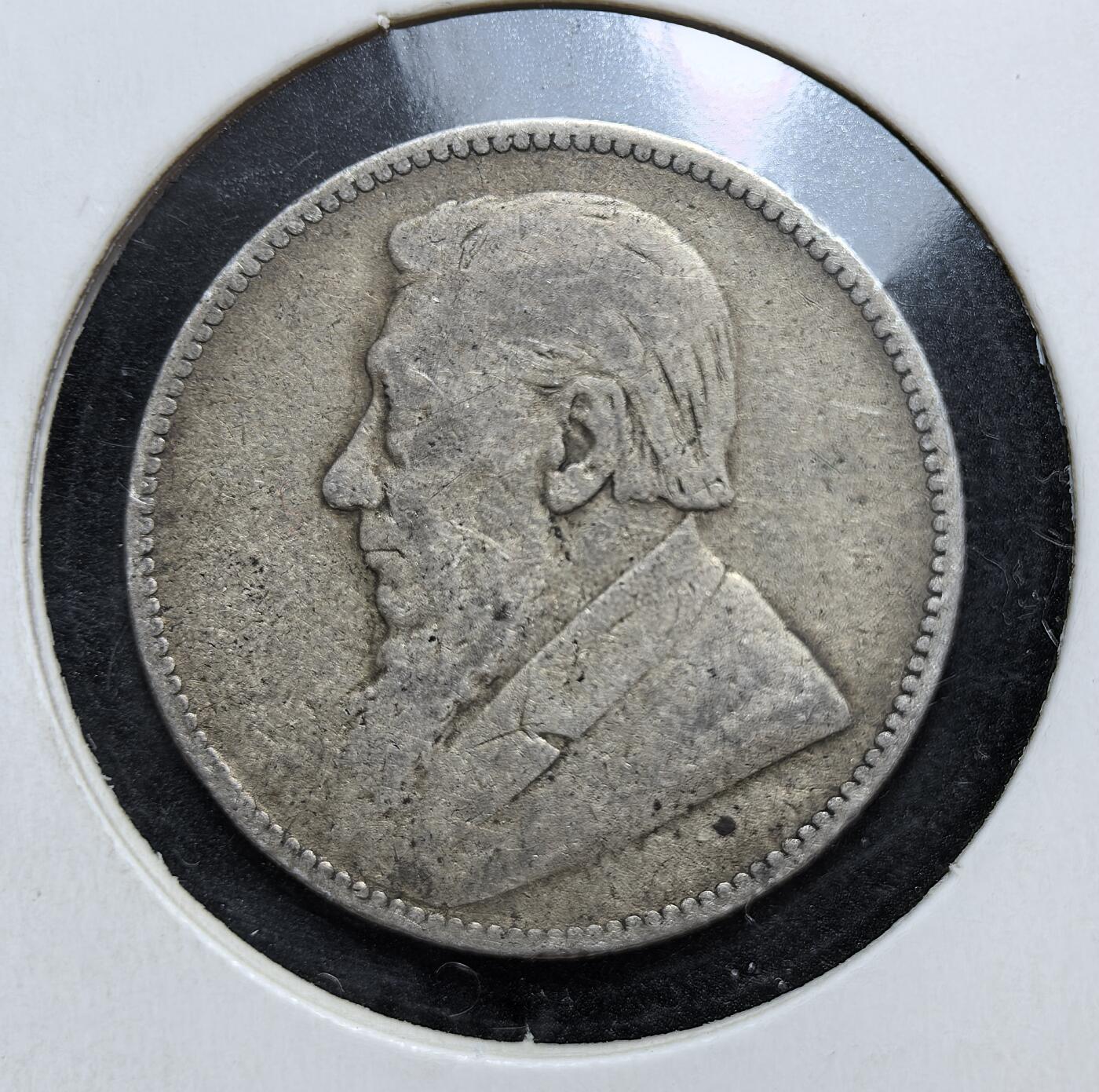 外国优质老铜币银币，正月十二晚九点倒数截拍，满百包邮可寄存，持续收拍 德兰士瓦共和国1897年1先令银币，正面为总统保罗・克鲁格像，背面是橡叶环饰与面值。发行于英布战争前夕，是布尔人反抗英国殖民统治、捍卫独立的重要货币遗存。