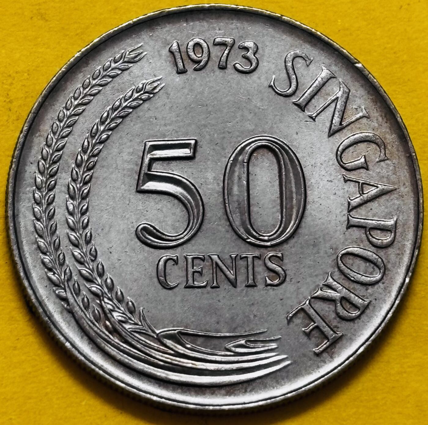 文馨钱币收藏第 295 场，（元宵场）各种银币散币纪念章，长期接代拍业务 好品 1973 年新加坡狮子鱼 50 分