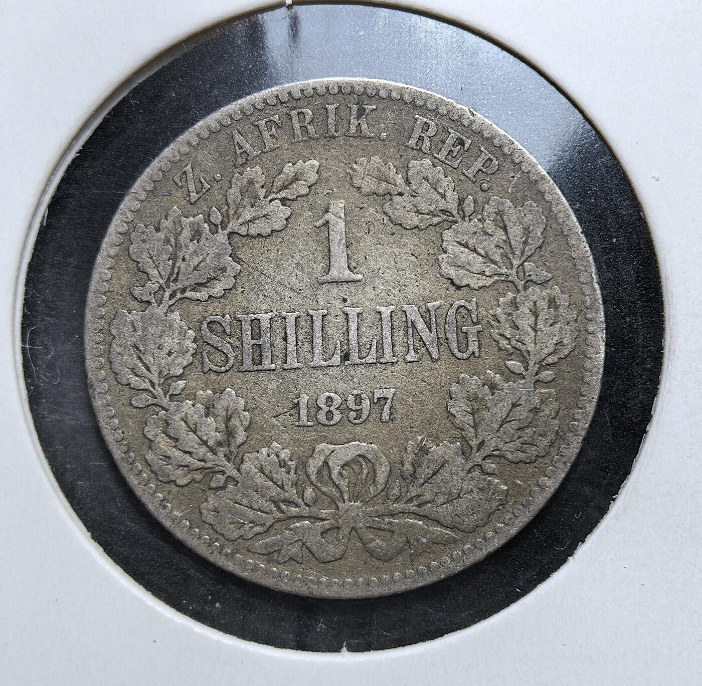 外国优质老铜币银币，正月十二晚九点倒数截拍，满百包邮可寄存，持续收拍 德兰士瓦共和国1897年1先令银币，正面为总统保罗・克鲁格像，背面是橡叶环饰与面值。发行于英布战争前夕，是布尔人反抗英国殖民统治、捍卫独立的重要货币遗存。