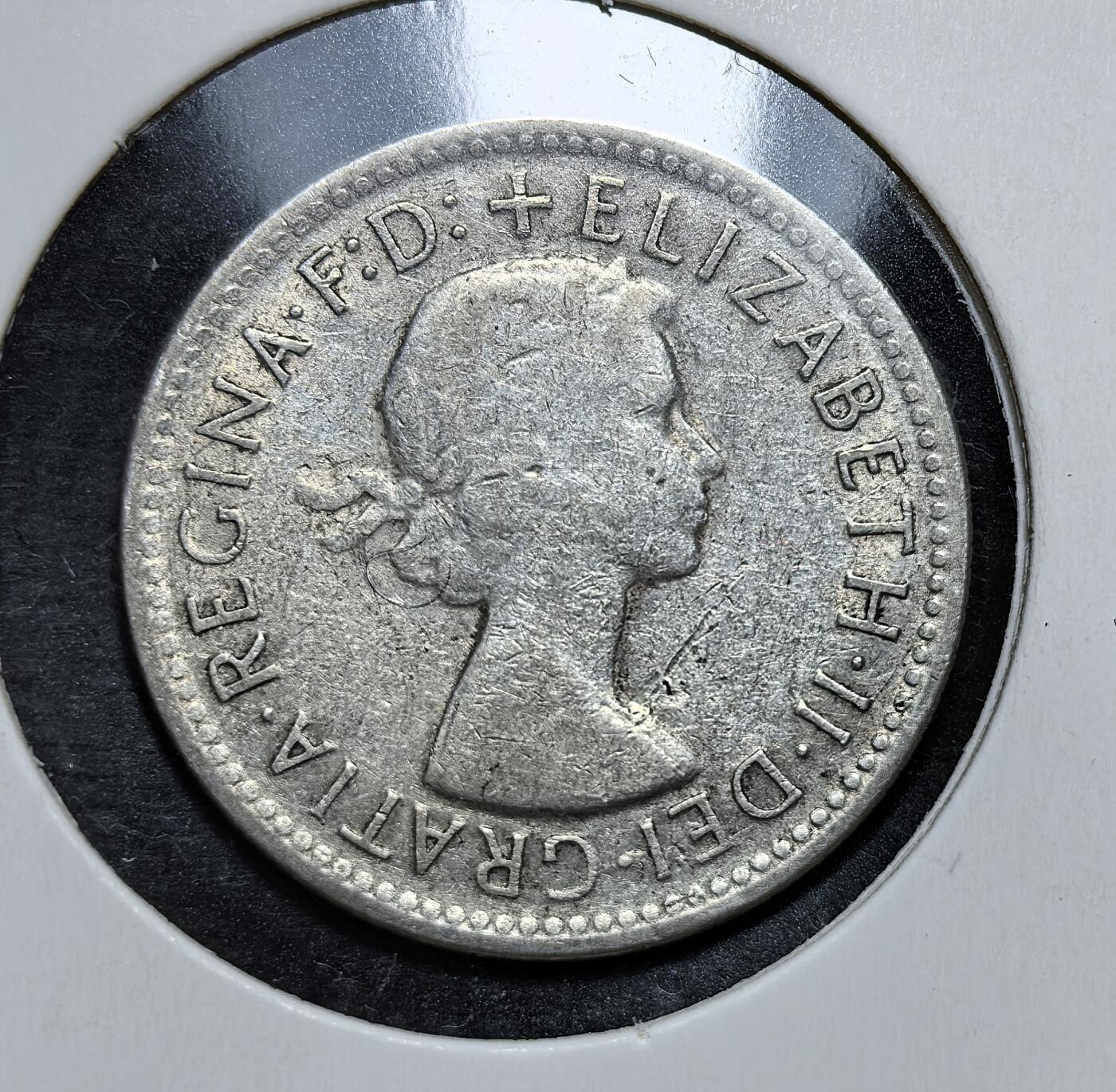 外国优质老铜币银币，正月十二晚九点倒数截拍，满百包邮可寄存，持续收拍 澳大利亚1961 年 1 先令银币，正面为伊丽莎白二世头像，背面是象征澳洲畜牧业的美利奴公羊。它发行于英联邦币制改革前夕，是澳大利亚从英制货币向十进制过渡前的代表性流通货币。