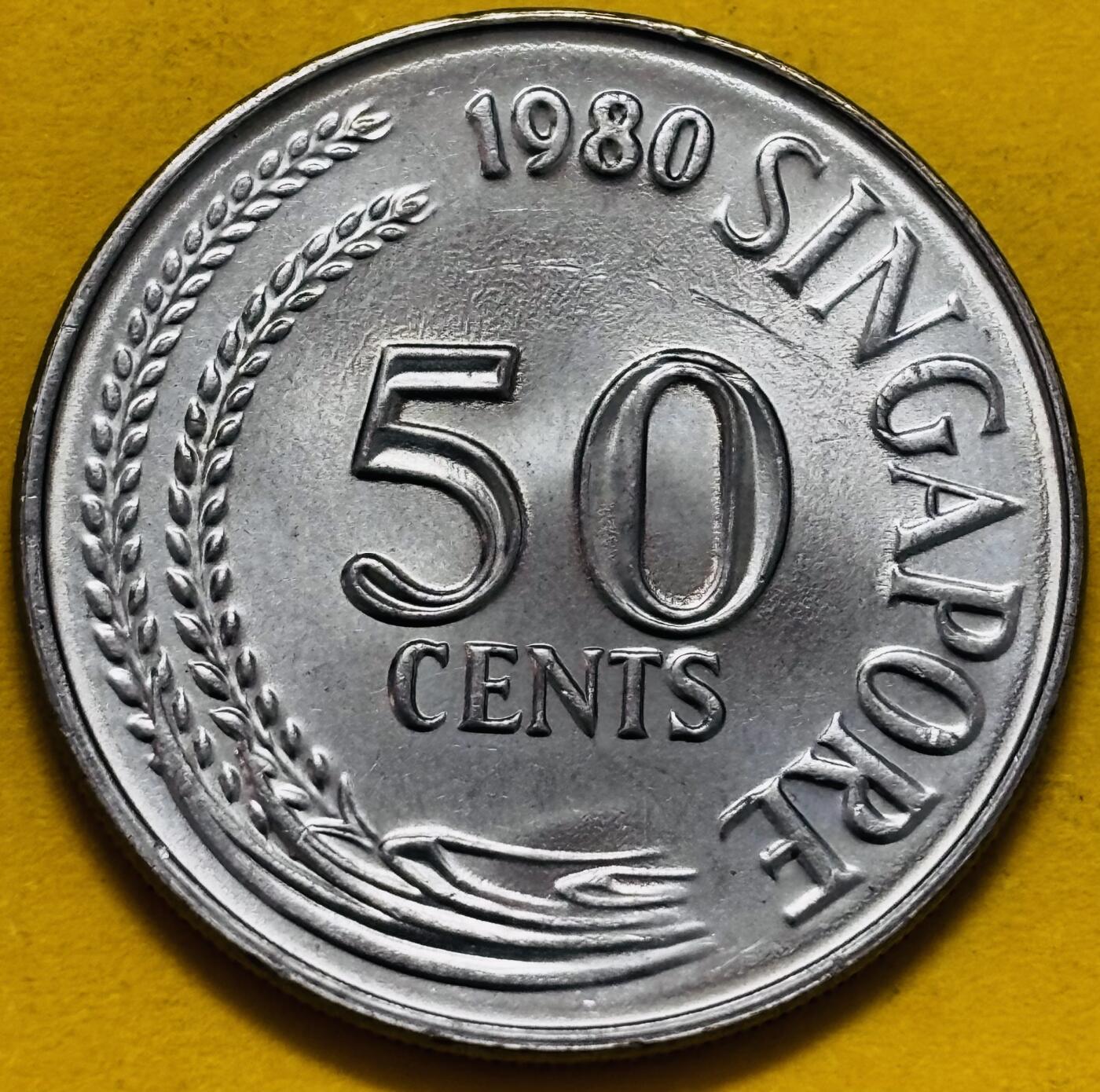 文馨钱币收藏第 295 场，（元宵场）各种银币散币纪念章，长期接代拍业务 原光 1980 年新加坡狮子鱼 50 分