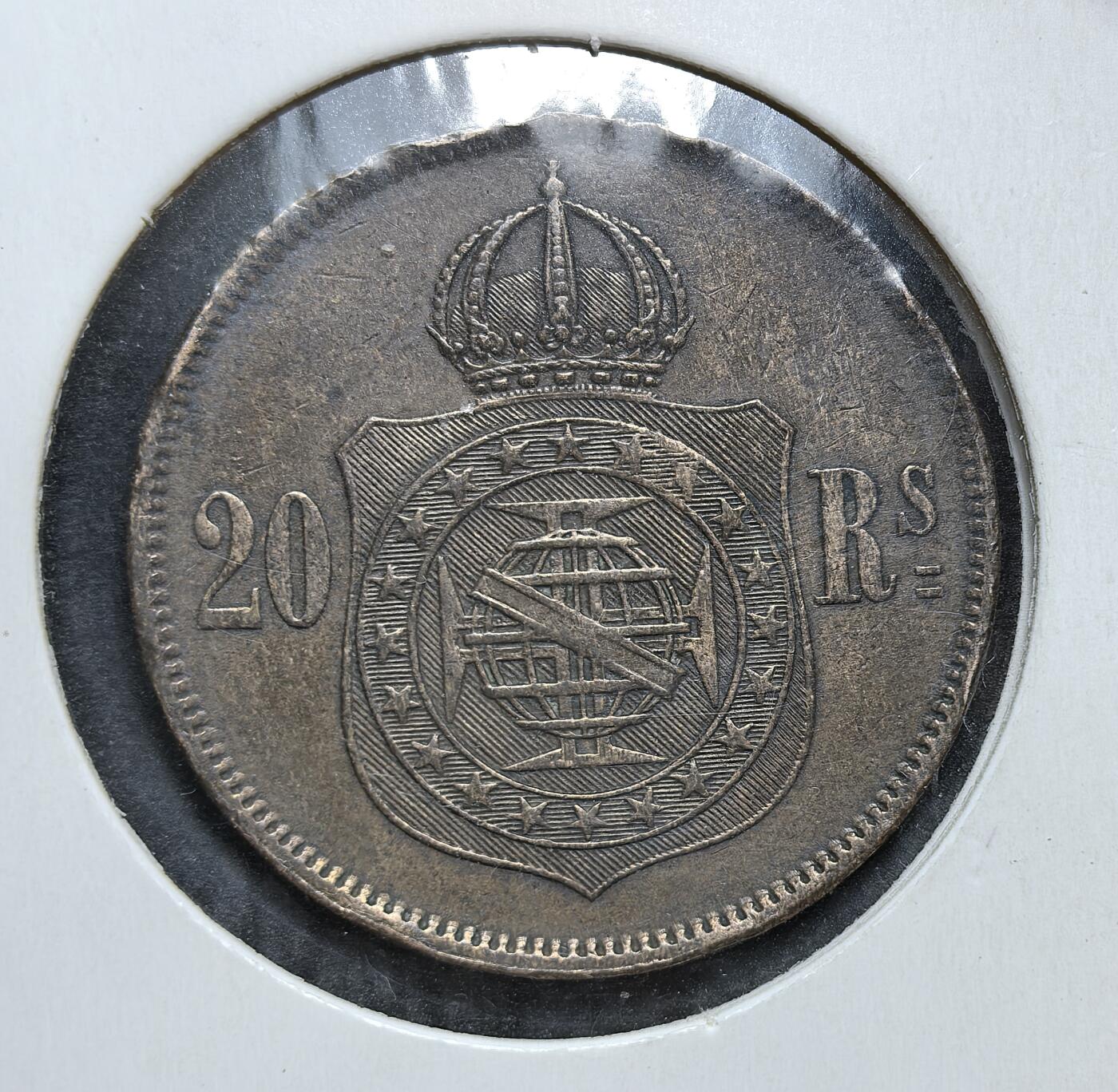 外国优质老铜币银币，正月十二晚九点倒数截拍，满百包邮可寄存，持续收拍 巴西帝国1869年20瑞斯，正面为佩德罗二世皇帝像，背面是帝国皇冠盾徽。属 1868 年新启的铜币系列，彼时巴西刚结束三国同盟战争，此币见证了帝国晚期的货币流通与战后复苏。