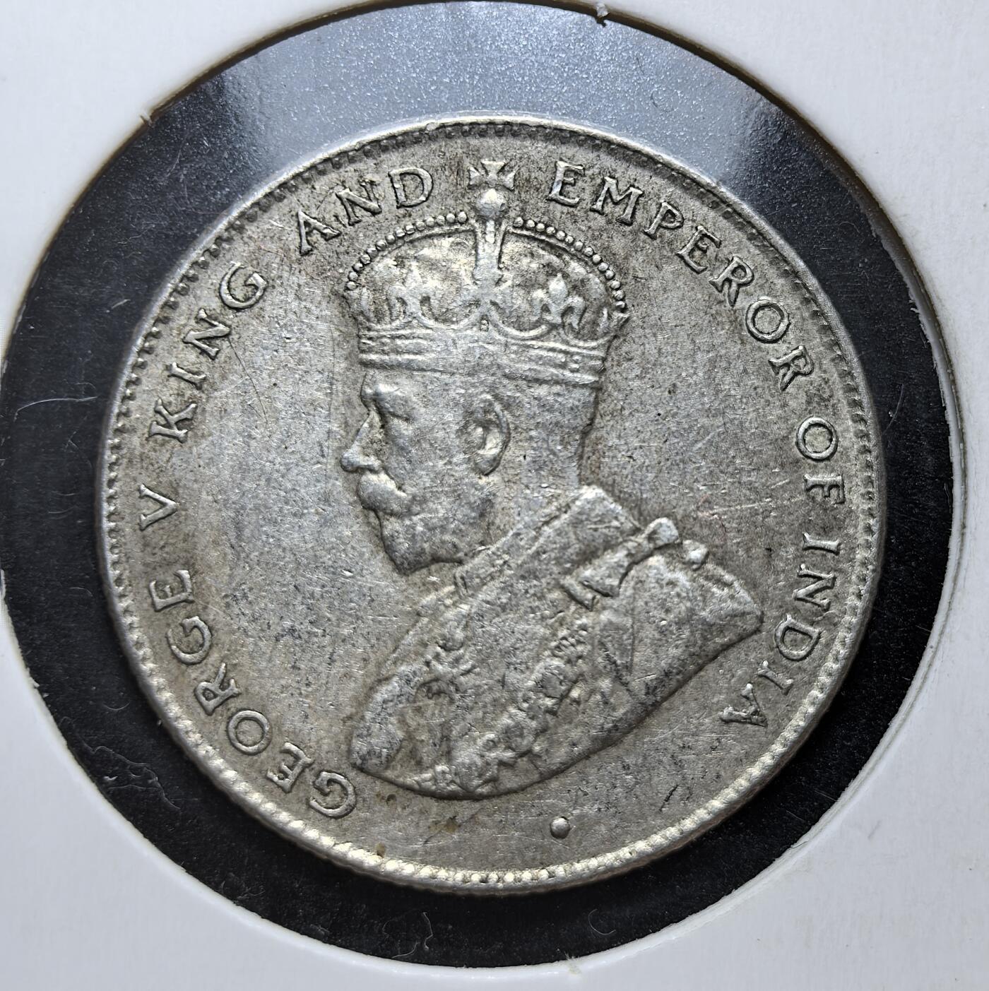 外国优质老铜币银币，正月十二晚九点倒数截拍，满百包邮可寄存，持续收拍 英属锡兰1921年50分银币，正面为英王乔治五世像，背面是锡兰国树铁木树与双语面值。发行于一战后经济恢复期，是英国殖民统治的货币遗存，见证了锡兰的殖民贸易与多元文化融合。