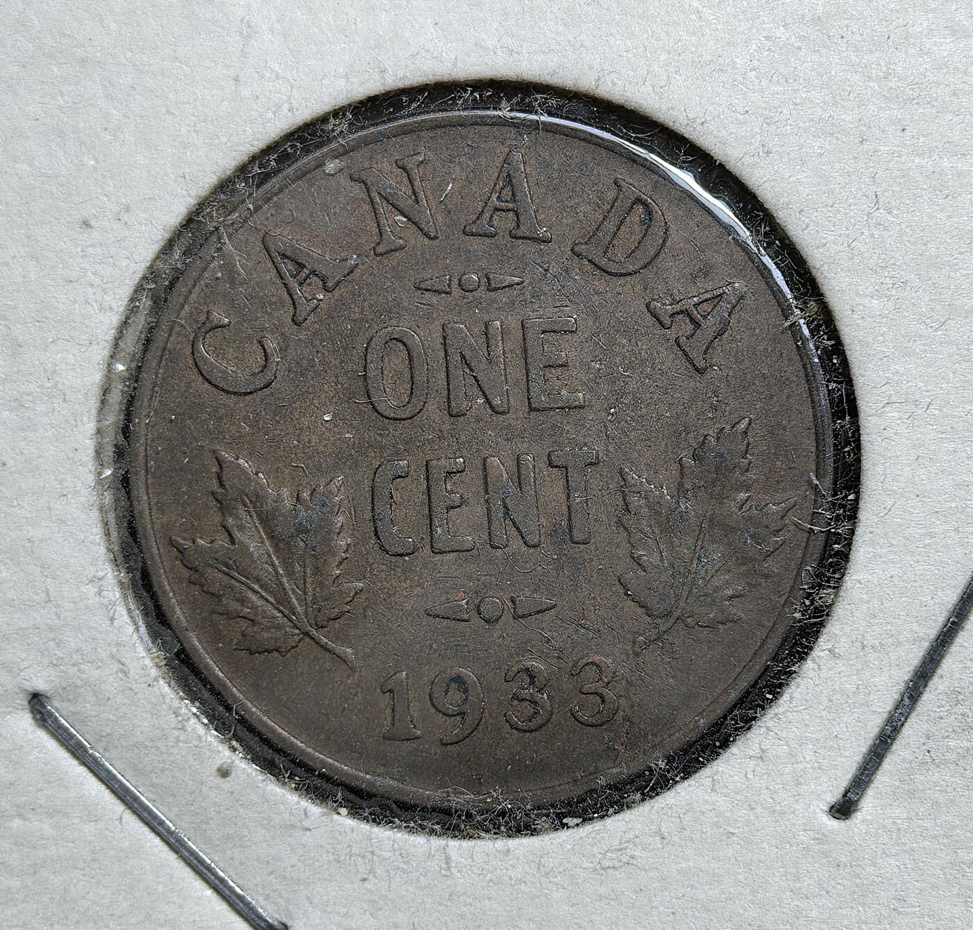 外国优质老铜币银币，正月十二晚九点倒数截拍，满百包邮可寄存，持续收拍 加拿大1933年1分铜币，正面为乔治五世高冠像，背面镌加拿大国花枫叶。发行于大萧条时期，是加拿大延续英联邦君主象征、强化国家身份认同的流通辅币，见证了加拿大在经济危机中的社会稳定。