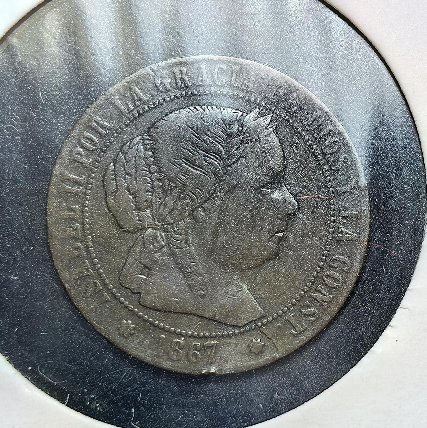 外国优质老铜币银币，正月十二晚九点倒数截拍，满百包邮可寄存，持续收拍 西班牙1867 年0.5 分铜币，正面为伊莎贝拉二世女王头像，背面是西班牙国徽。此币发行于女王统治末期，见证了西班牙在殖民衰退与国内动荡中，维持货币体系运行的历史阶段。