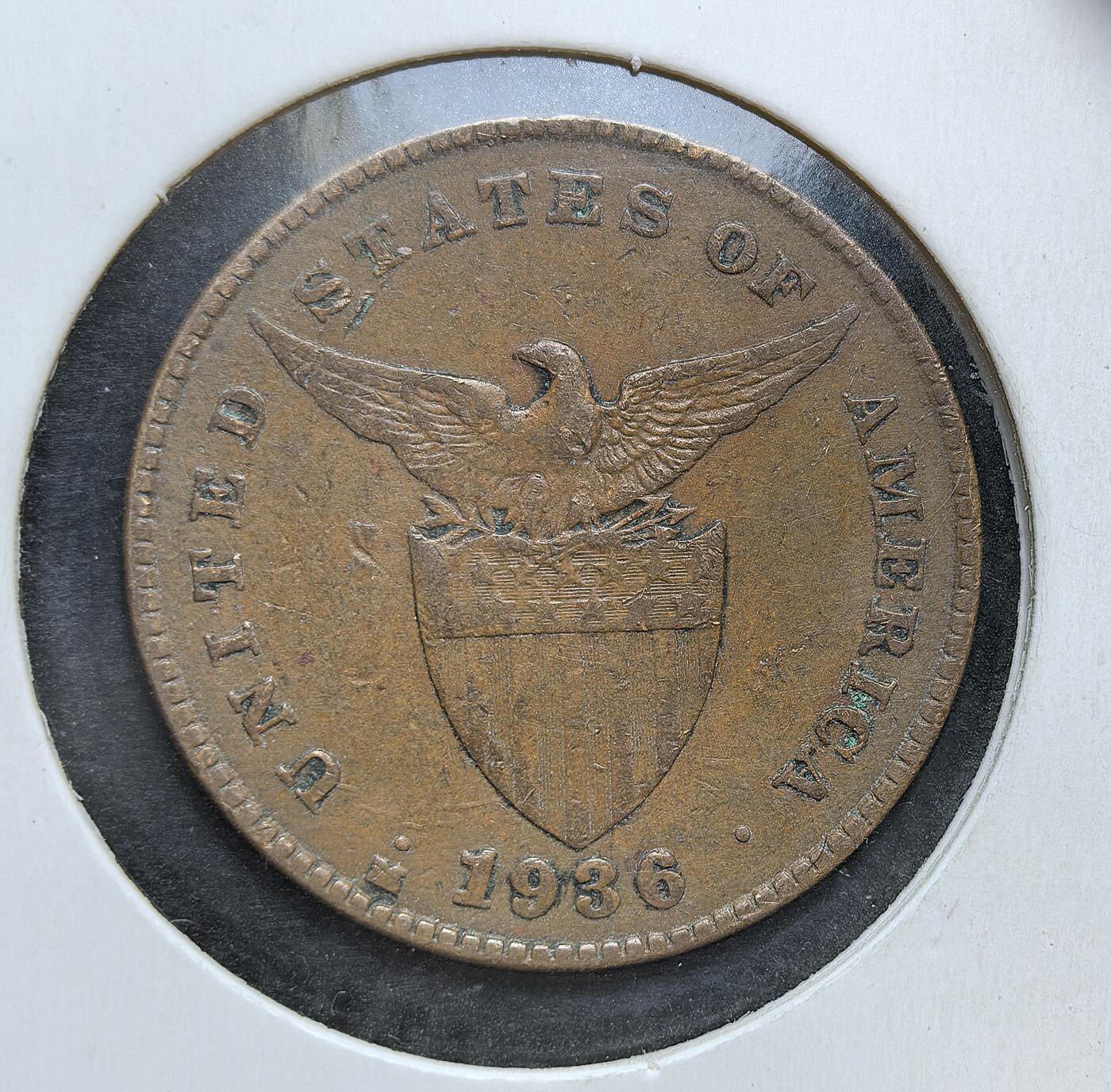 外国优质老铜币银币，正月十二晚九点倒数截拍，满百包邮可寄存，持续收拍 美属菲律宾1936年1分铜币M版，正面为美国国徽样式的鹰盾图案，背面是手持锤子的摩洛人形象。彼时菲律宾为美国未合并领土，该币是美国殖民统治时期的流通辅币，见证了菲律宾特殊的殖民货币史与社会风貌。