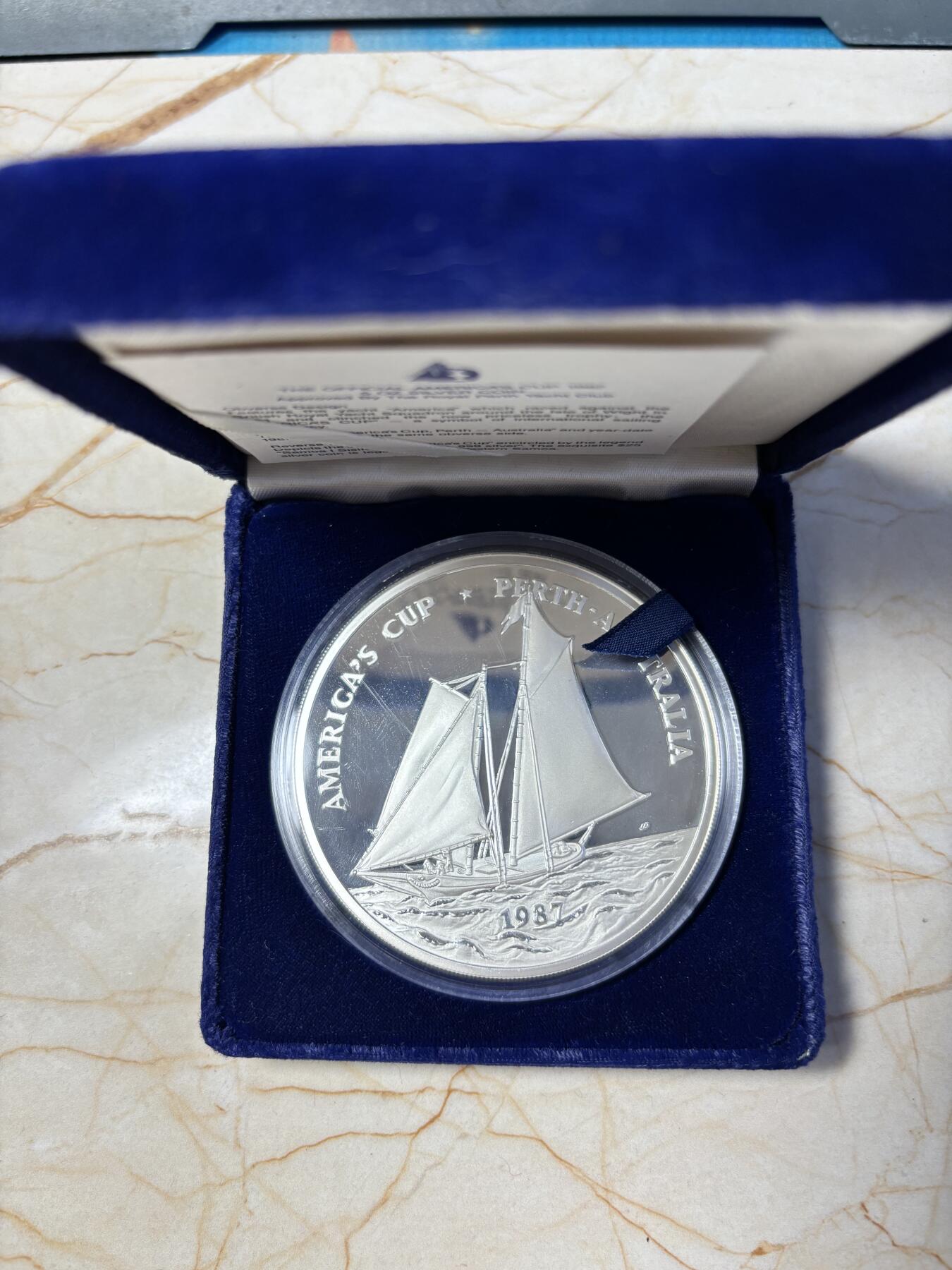 第191期拍卖 萨摩亚1987年25塔拉精制银币 美洲杯 5盎司999银 发行量：3900 盒证全（新加坡代铸）