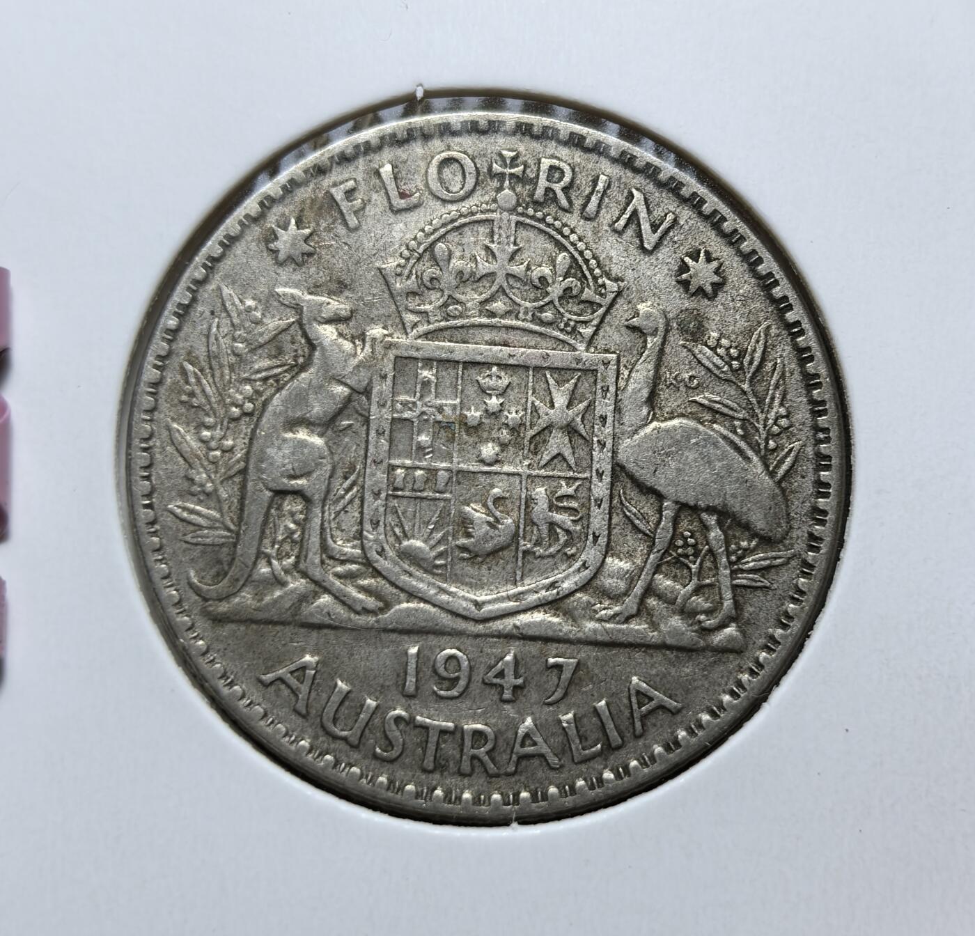 外国优质老铜币银币，正月十二晚九点倒数截拍，满百包邮可寄存，持续收拍 澳大利亚 1947年1弗洛林银币，正面为英王乔治六世像，背面是袋鼠与鸸鹋环绕的国徽。它发行于二战后货币过渡时期，是英联邦时代澳大利亚的代表性流通银币。