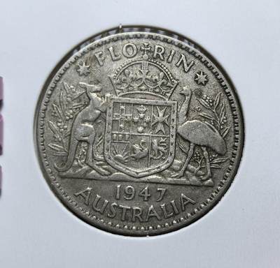 外国优质老铜币银币，正月十二晚九点倒数截拍，满百包邮可寄存，持续收拍 - 澳大利亚 1947年1弗洛林银币，正面为英王乔治六世像，背面是袋鼠与鸸鹋环绕的国徽。它发行于二战后货币过渡时期，是英联邦时代澳大利亚的代表性流通银币。