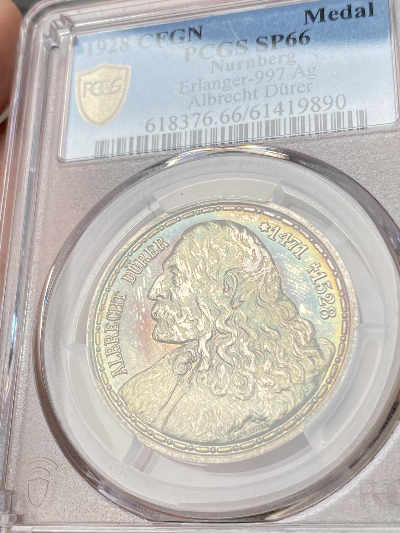 万国钱币拍卖第062期 PCGS SP66 1928年德国纽伦堡版画画圣丢勒逝世400周年纪念银章 精铸镜面满满喷砂质感 绚烂晚霞金彩原味包浆环绕 丢勒系列最精美绝伦品种没有之一 PCGS亚军分官网广告图顶级收藏品质