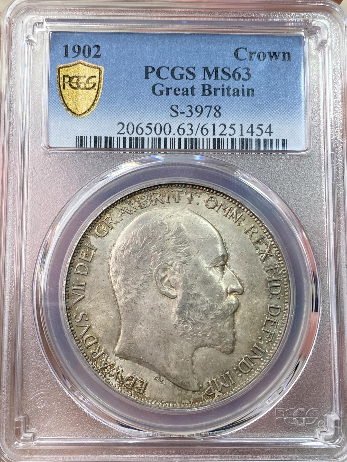 万国钱币拍卖第062期 PCGS MS63 1902年英国爱德华七世马剑克朗 高分难度大于精制的流通品种 车轮转光底板在油画般的英伦淡五彩包浆加持下更添魅力