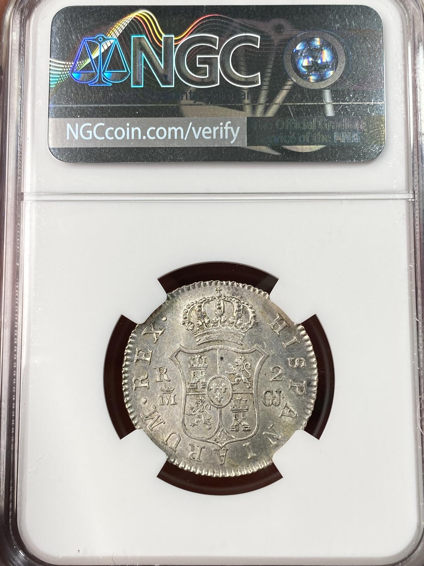 万国钱币拍卖第062期 NGC MS62 1820年西班牙费迪南德七世2R银币 全深打盾徽细节犀利 十字转光淡彩环绕