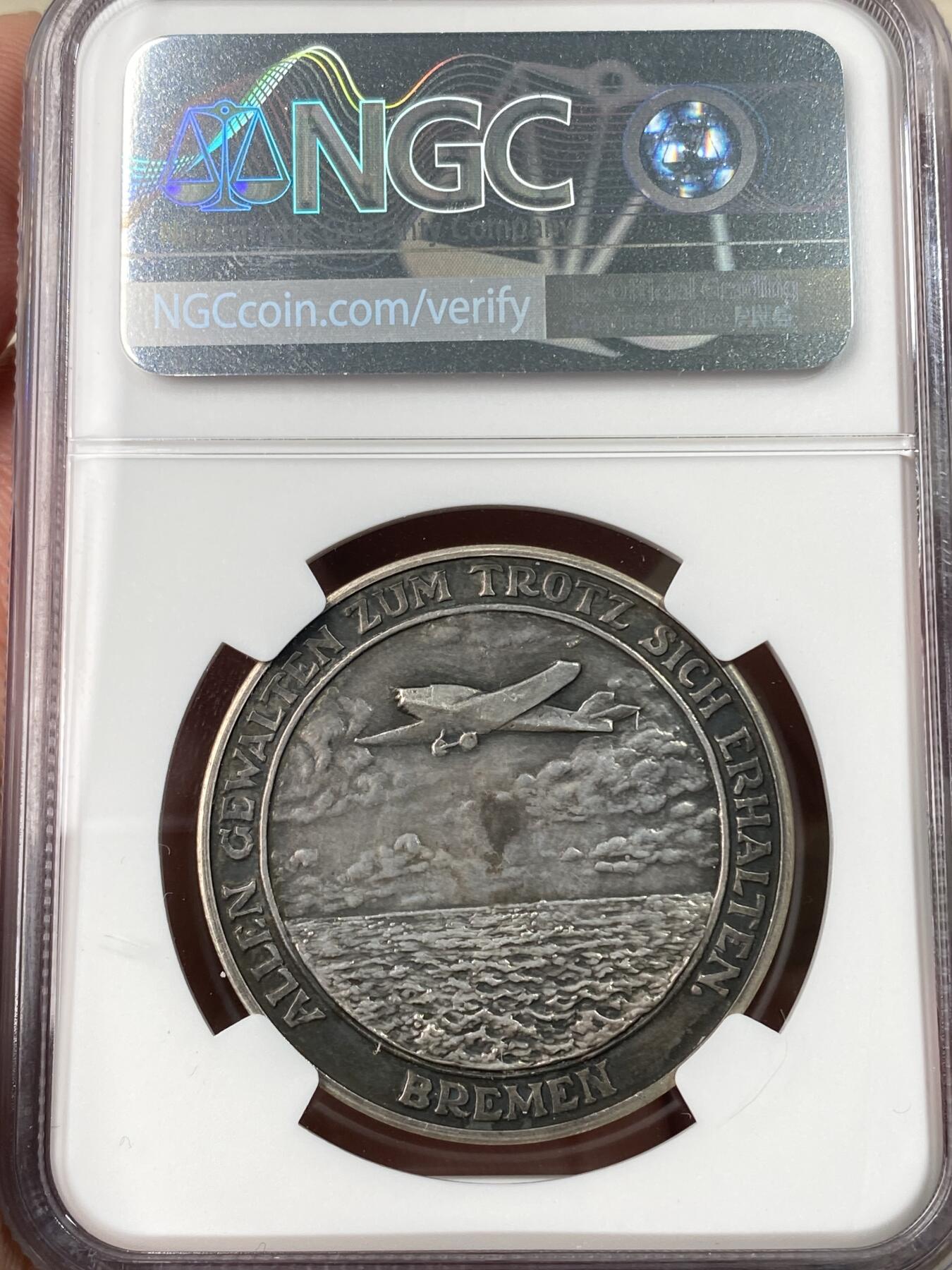 万国钱币拍卖第062期 NGC AU58 1928年德国不莱梅兄弟飞跃大西洋纪念银章 高浮雕酱黑彩