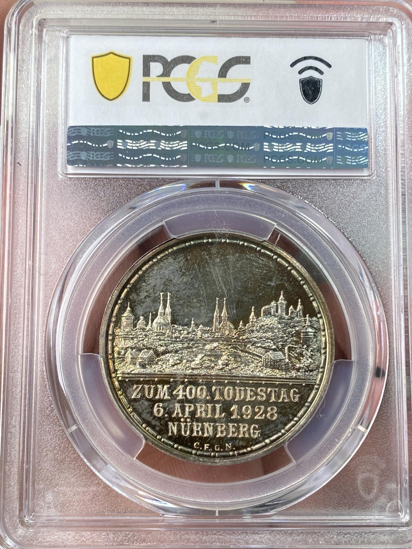 万国钱币拍卖第062期 PCGS SP66 1928年德国纽伦堡版画画圣丢勒逝世400周年纪念银章 精铸镜面满满喷砂质感 绚烂晚霞金彩原味包浆环绕 丢勒系列最精美绝伦品种没有之一 PCGS亚军分官网广告图顶级收藏品质