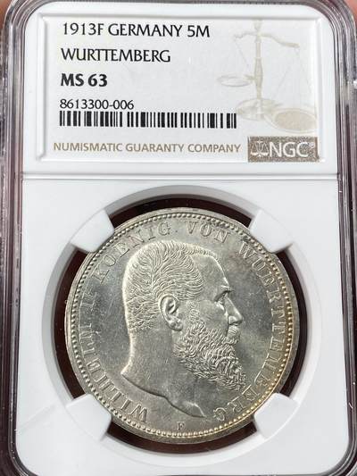 万国钱币拍卖第062期 - NGC MS63 1913年德国符腾堡威廉二世长翅流通5马克 银霜十字转光淡彩环绕 收藏级品质