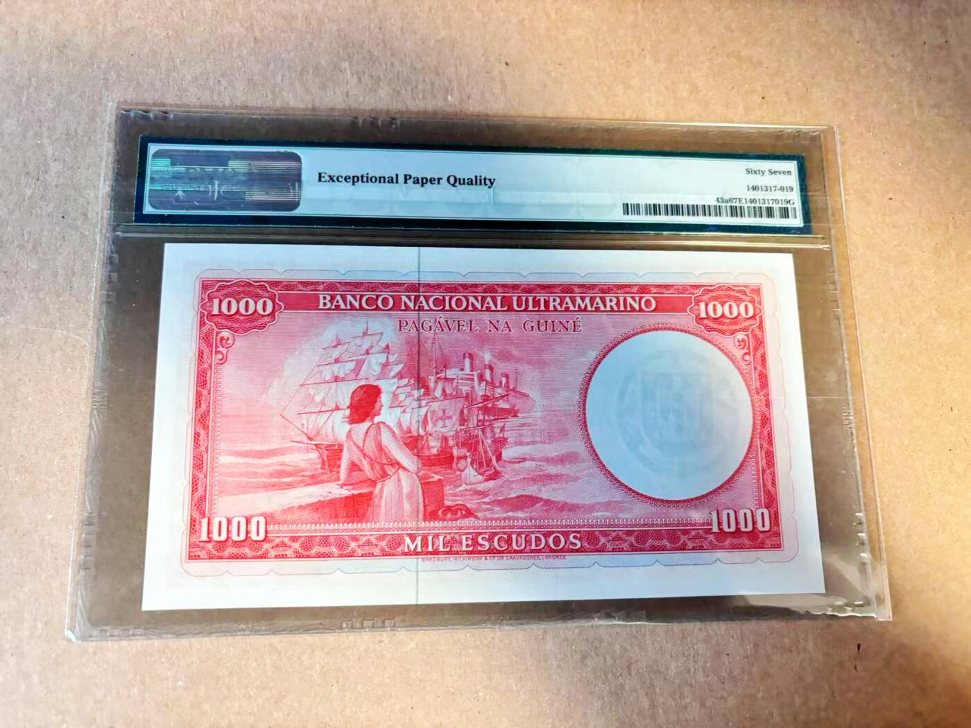 【Blue Auction】世界纸币精拍第789期——18级TOP拍卖/信誉/品质/专业/高效💫  【冠军分 66尾】葡属几内亚 1964年1000埃斯库多 PMG67EPQ 高分 BWC出品雕刻精美 人物为霍里奥·巴雷托 背面经典场景