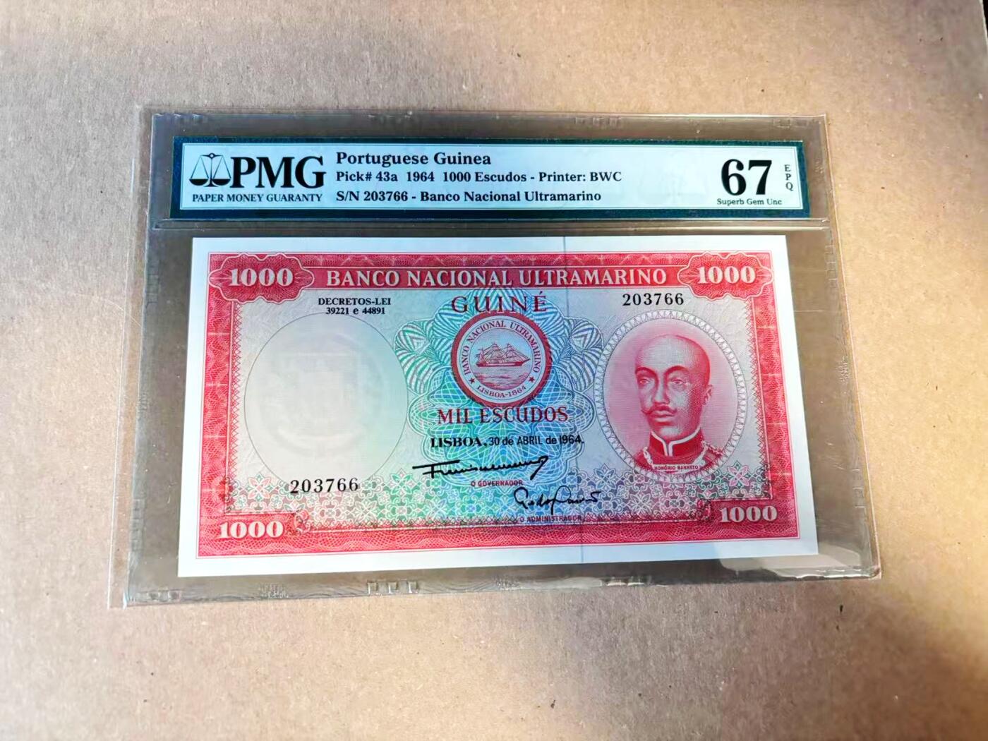 【Blue Auction】世界纸币精拍第789期——18级TOP拍卖/信誉/品质/专业/高效💫  【冠军分 66尾】葡属几内亚 1964年1000埃斯库多 PMG67EPQ 高分 BWC出品雕刻精美 人物为霍里奥·巴雷托 背面经典场景