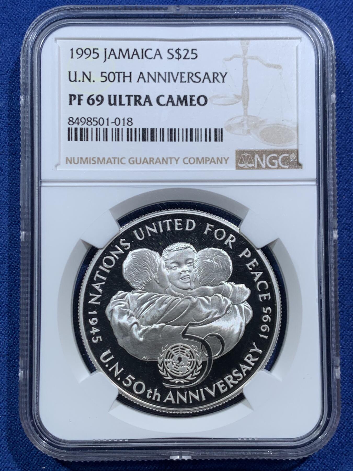 《竞宝斋》第466场 周日，周一 2场连拍 （全场包邮）欢迎送拍 NGC PF69UC 牙买加1995年各国人民为和平而团结-联合国成立50周年镜面高浮雕25元精制纪念银币，925银，28.28克，发行量105000枚，主题意义重大，收藏价值高。