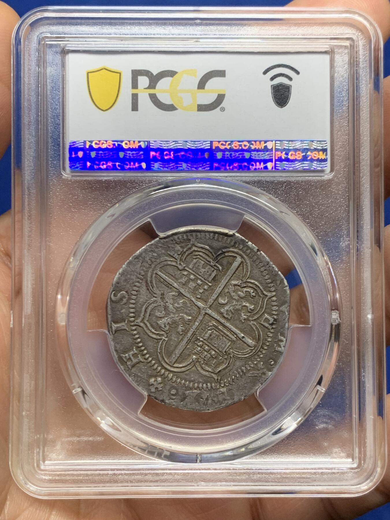 《竞宝斋》第467场 周日，周一 2场连拍 （全场包邮）欢迎送拍 PCGS AU50 西班牙帝国 1556-88年 菲利普二世4里亚尔十字银币 塞维利亚厂，季军分，打制的十分美，正面盾徽和背面狮子城堡的细节很清楚，远超同类品种