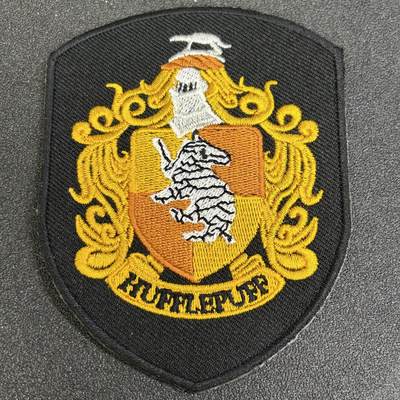 西秦中古拍卖第七十九期  - 哈利·波特 霍格沃茨魔法学校赫夫帕夫学院的刺绣徽章