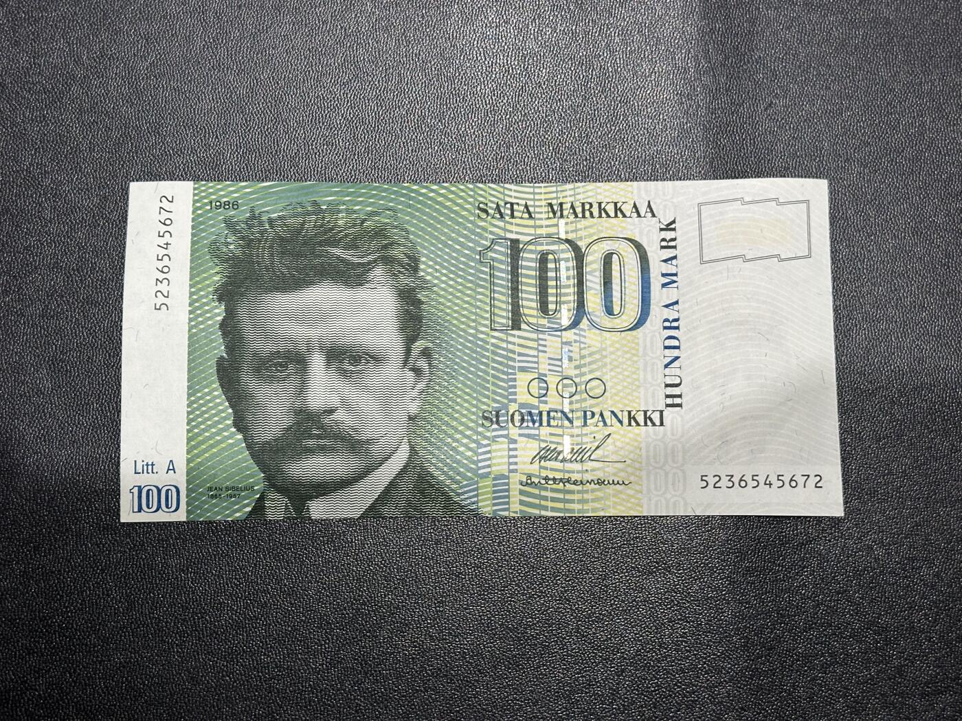 《外钞收藏家》第六百一十四期（精选场）（长期征集拍品、欢迎藏友们联系合作） 1986年芬兰100克朗 中间有点软榻 疑似有瑕疵