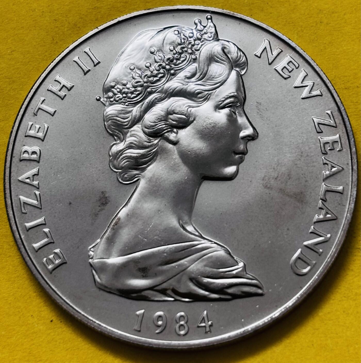 文馨钱币收藏第 295 场，（元宵场）各种银币散币纪念章，长期接代拍业务 全新 1984 年新西兰知更鸟 1 元 镜面工艺像精制币