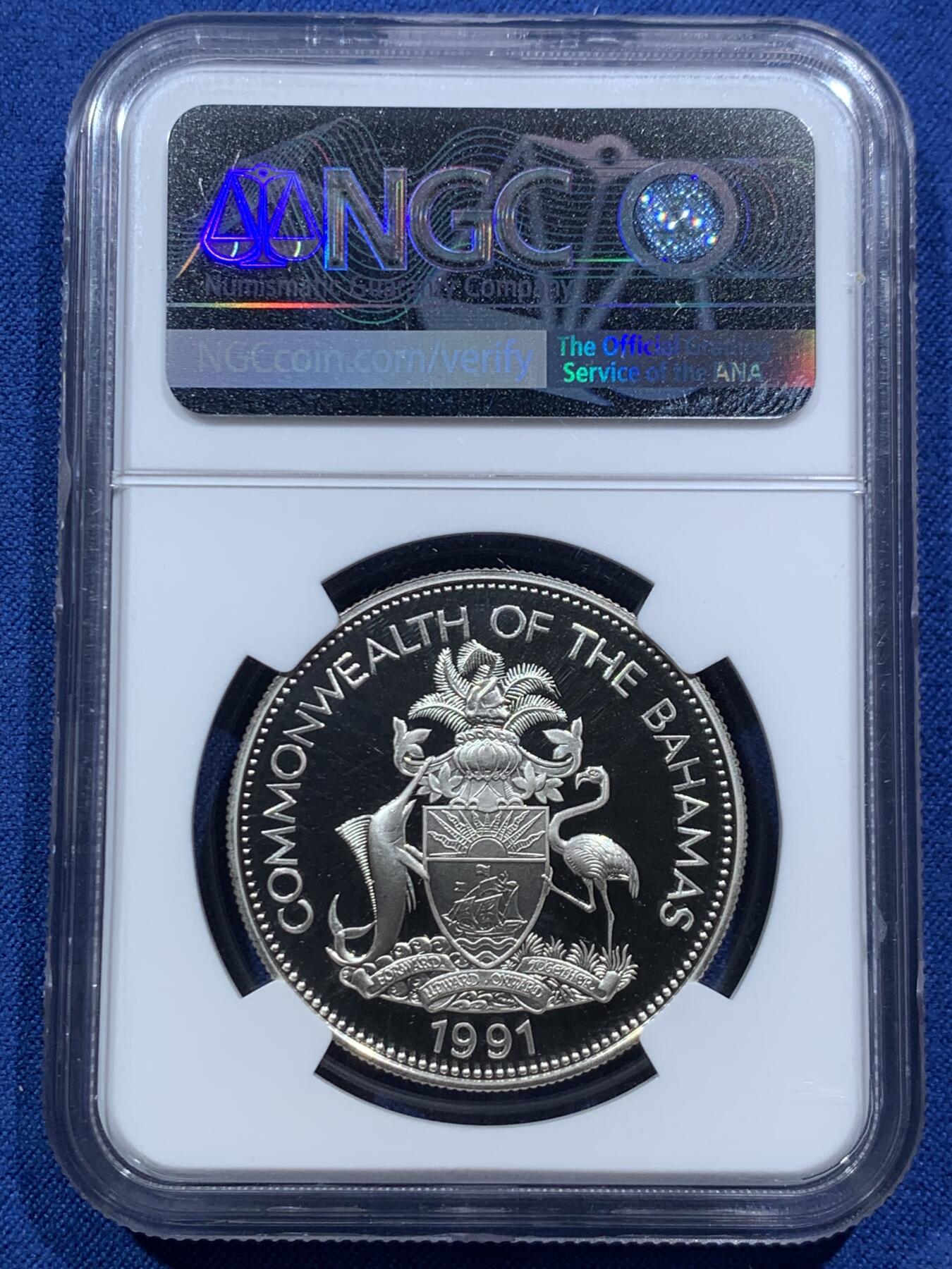 《竞宝斋》第467场 周日，周一 2场连拍 （全场包邮）欢迎送拍 NGC PF69UC 巴哈马1991年哥伦布发现美洲500周年5元精制纪念银币，镜面超高浮雕，19.44克，925银，精制银币作为赠品，收藏价值高。