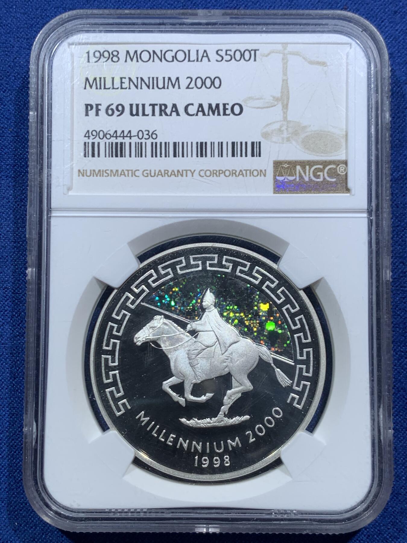 《竞宝斋》第467场 周日，周一 2场连拍 （全场包邮）欢迎送拍 NGC PF69UC 1998年蒙古迎接千禧年（2000）发行成吉思汗骑马图，镜面超高浮雕精制银币，全息幻彩工艺，500图格里克，一盎司，925银，31.6克，10000枚发行量