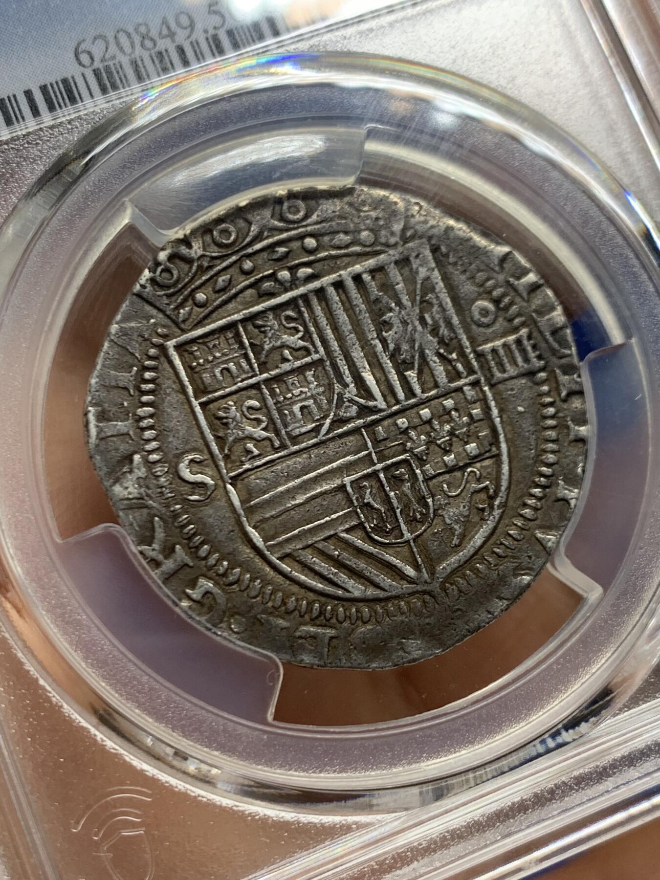 《竞宝斋》第467场 周日，周一 2场连拍 （全场包邮）欢迎送拍 PCGS AU50 西班牙帝国 1556-88年 菲利普二世4里亚尔十字银币 塞维利亚厂，季军分，打制的十分美，正面盾徽和背面狮子城堡的细节很清楚，远超同类品种