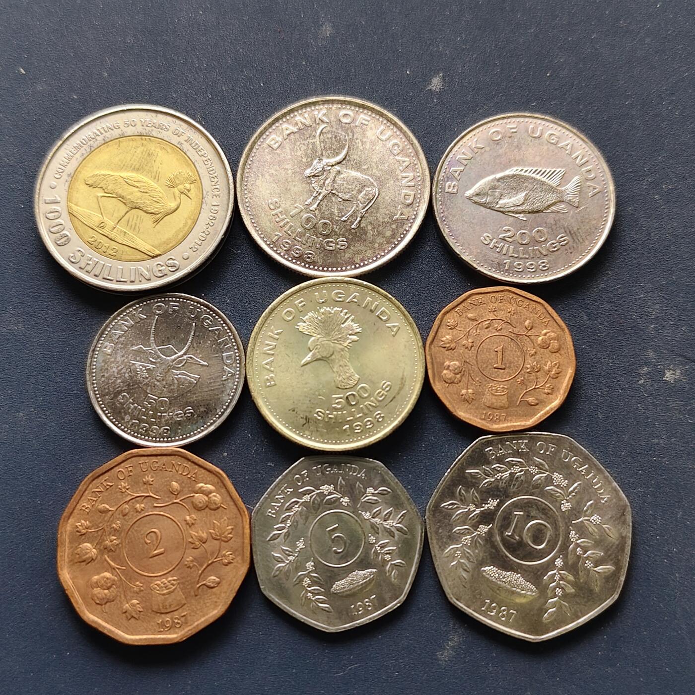 【全场包邮】纯粹捡漏拍508场 乌干达各年份9枚套币-含1000先令独立50周年双色纪念币