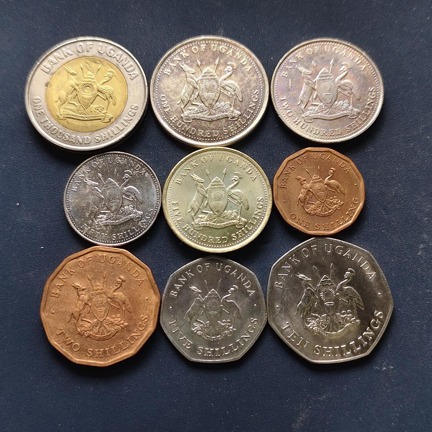 【全场包邮】纯粹捡漏拍508场 乌干达各年份9枚套币-含1000先令独立50周年双色纪念币