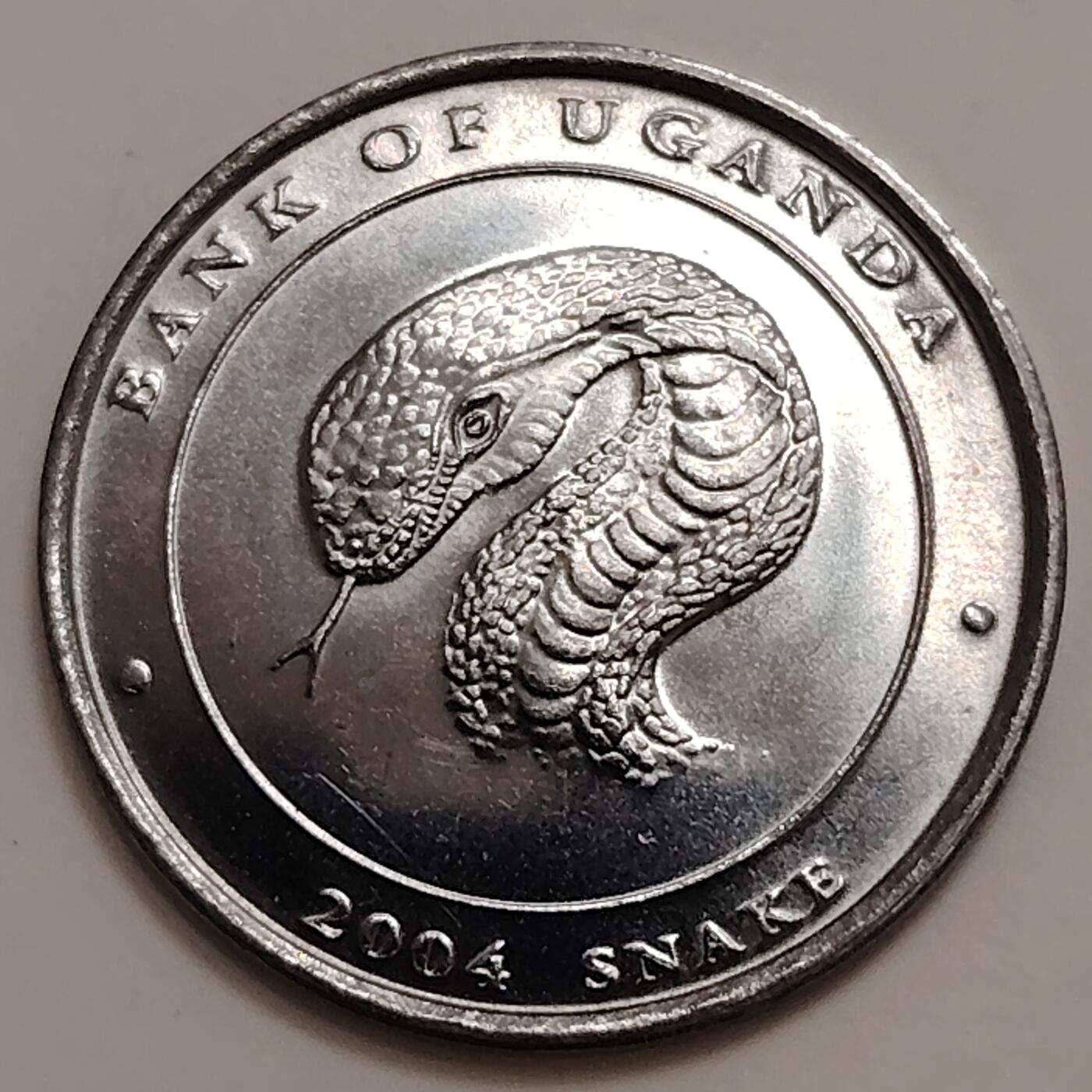 布加迪🐬～世界钱币(上海)🌾第 279 期 /  各国套币和散币 乌干达🇺🇬 2004年 100先令生肖币～蛇