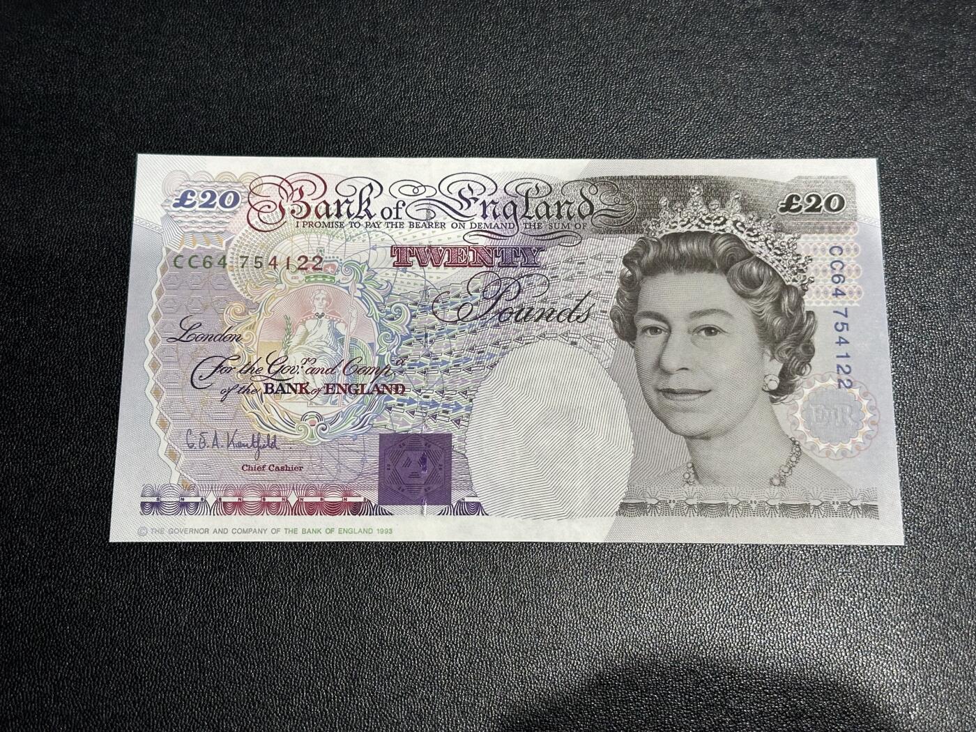 《外钞收藏家》第六百一十五期（畅拍场）（长期征集拍品、欢迎藏友们联系合作） 英国E序列20镑 UNC- 有潮斑