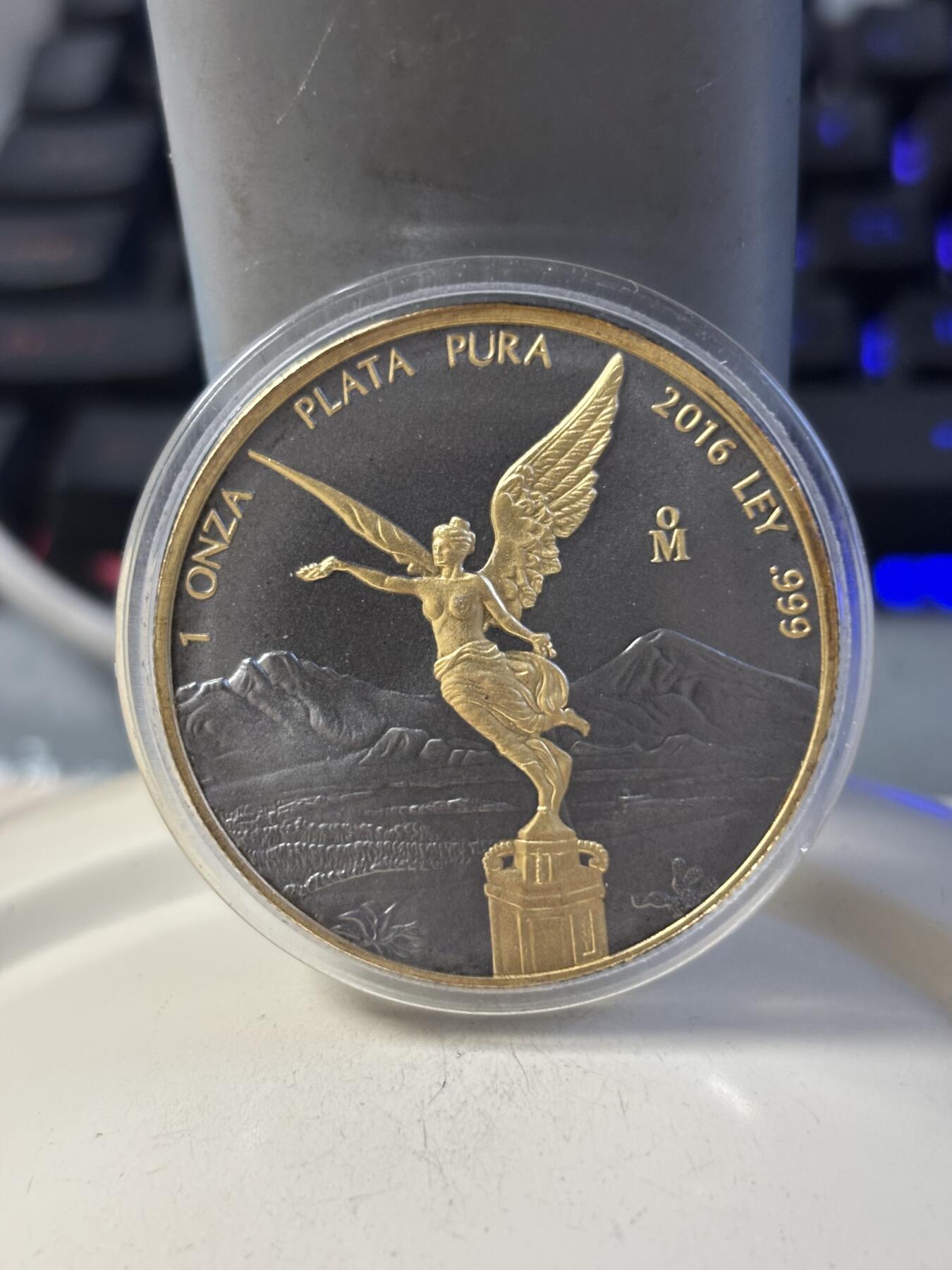 第192期拍卖 墨西哥2016年自由女神1盎司镀金钌化纪念银币，999银。