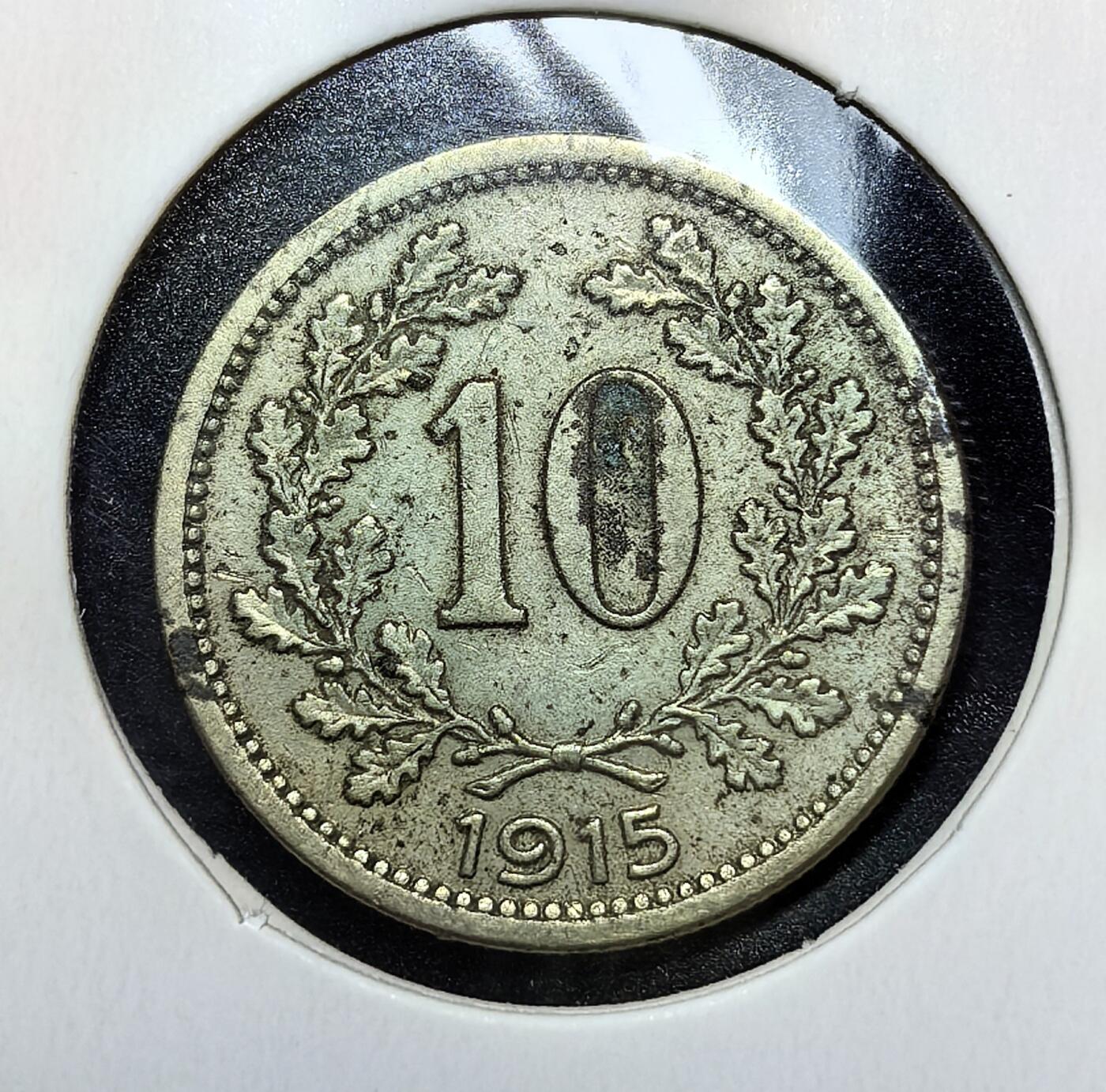 外国优质老铜币银币苏联纪念章，每周六晚九点倒数截拍，满百包邮可寄存，持续收拍 奥匈帝国1915 年10 赫勒，正面双头鹰是帝国象征，背面橡叶环饰数字与年份，见证帝国晚期通胀与解体前的动荡。